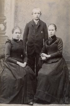 Studio portrait of three siblings, c1900. Artist: Unknown