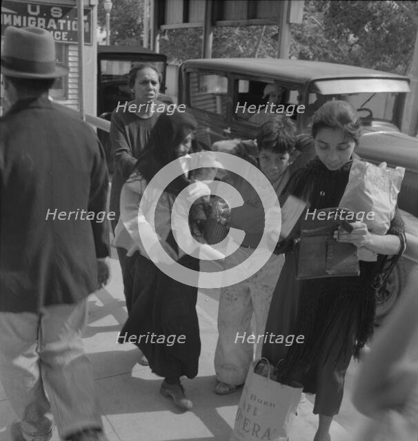 El Paso housewives after a day's shopping in Juarez, Mexico, Texas, 1937. Creator: Dorothea Lange.