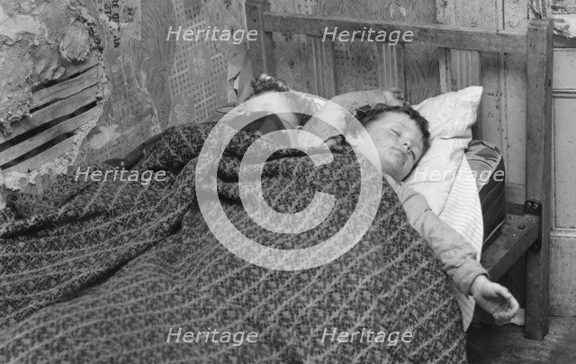 Children asleep in a slum dwelling in London's East End, 1965. Artist: Unknown