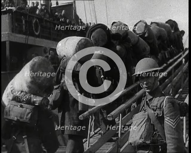 Male British Expeditionary Force Solders With Their Packs Walking up a Gangplank Past..., 1939. Creator: British Pathe Ltd.