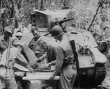 Commonwealth Troops Planning Next to a Tank, 1943. Creator: British Pathe Ltd.