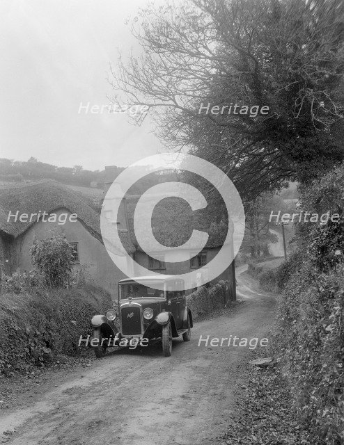 1931 Austin 16/6 on a road test, parked outside Parliament Cottage, Stoke Gabriel, Devon. Artist: Bill Brunell.