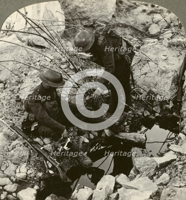 Giving water to a wounded pal, Hooge, Ypres, Belgium, World War I, 1914-1918.Artist: Realistic Travels Publishers