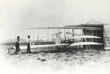 Wilbur and Orville Wright with Flyer II at Huffman Prairie, Dayton, Ohio, USA, May 1, 1904.  Creator: NASA.
