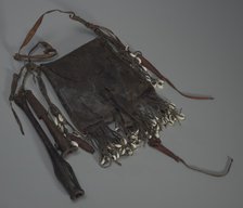 Leather bag with tools, whistles, and shells, 20th Century. Creator: Unknown.
