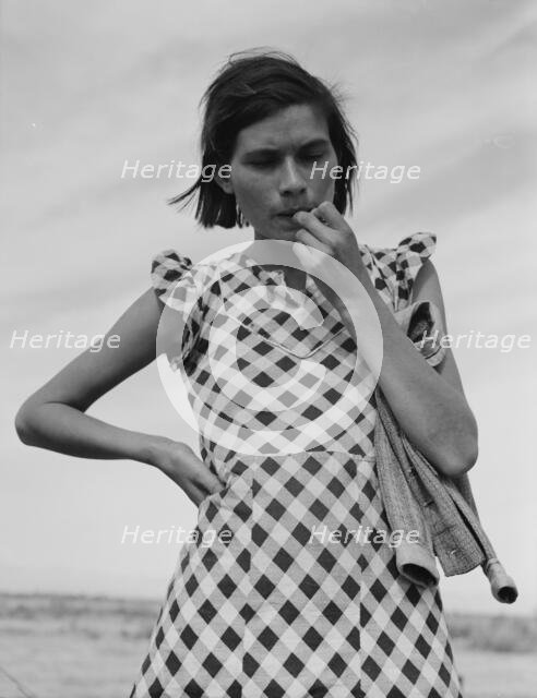A mother in California who with her family will be returned to Oklahoma by the Relief..., 1937. Creator: Dorothea Lange.
