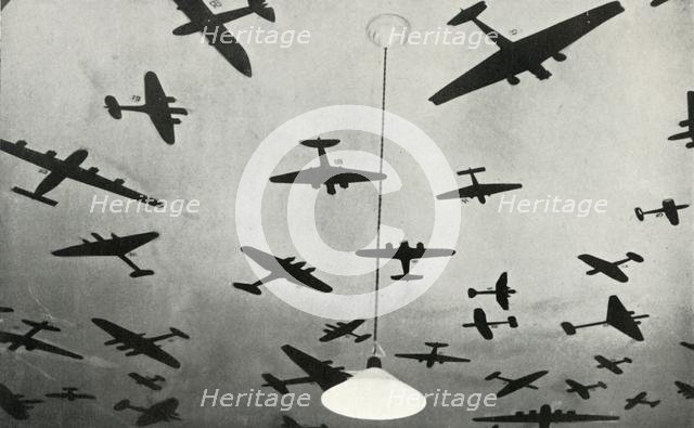 Silhouettes of military aircraft...at an RAF training school during the Second World War, 1941. Creator: Charles Brown.