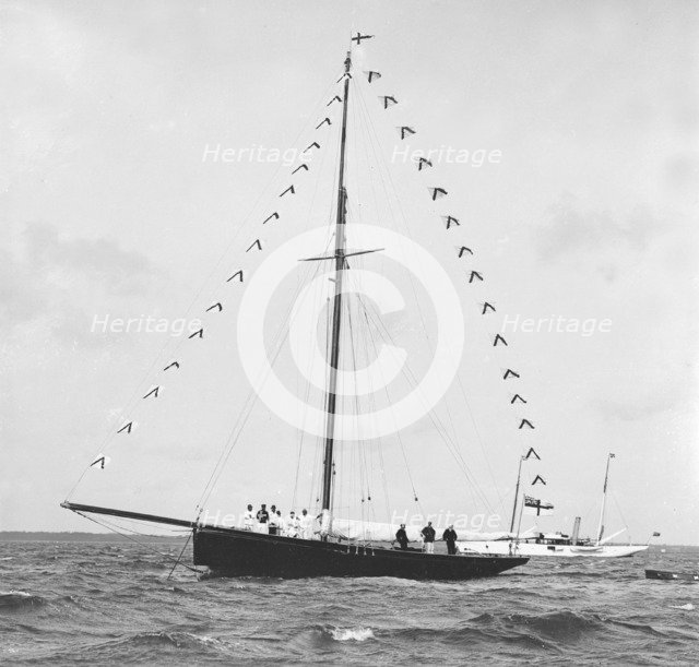 'Bloodhound' at anchor with prize flags, 1909. Creator: Kirk & Sons of Cowes.