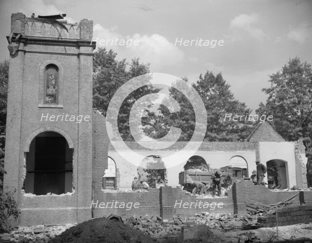 Laborers wrecking houses on Independence Avenue, Washington, D.C, 1942. Creator: Gordon Parks.