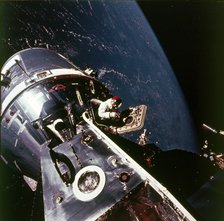 Module pilot David Scott emerging from Apollo 9 spacecraft, 6 March 1969. Creator: Russell Schweickart.