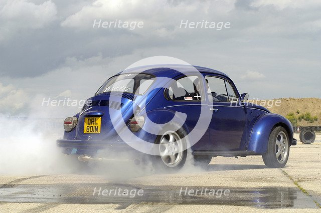 VW Beetle Burning out. Artist: Unknown.