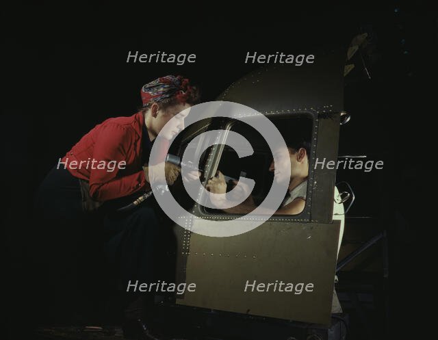 Men and women make efficient operating teams...Douglas Aircraft plant, Long Beach, Calif. , 1942. Creator: Alfred T Palmer.