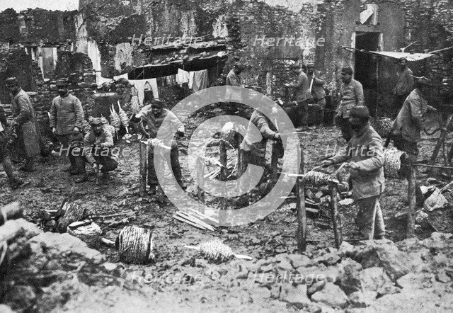 Barbed wire spooling, the defence of Verdun, France, First World War, 1916, (c1920). Artist: Unknown