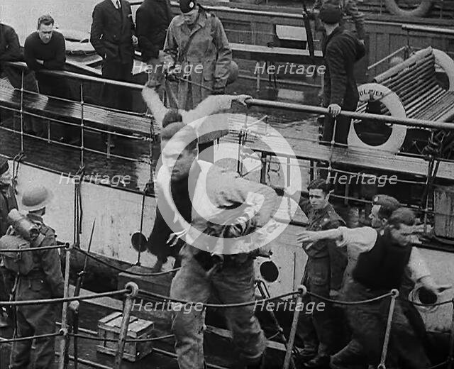 Crew of the Destroyed Bismarck Walking up a Gangplank Into a British Ship, 1943. Creator: British Pathe Ltd.