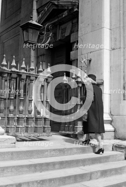 Woman entering the church of St Martin in the Fields, London, c1950. Artist: SW Rawlings