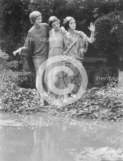 People wearing masks made by W.T. Benda, 1925 Sept. 20. Creator: Arnold Genthe.