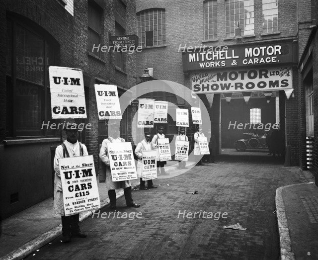 Sandwich board men advertising outside Mitchell Motors, 114 Wardour Street, London, 1910. Artist: Bedford Lemere and Company.