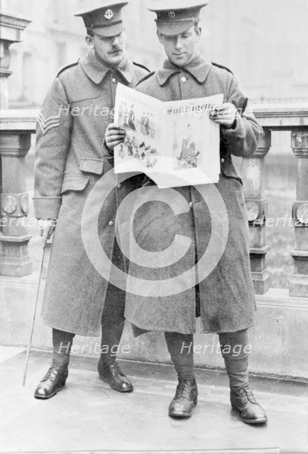 Soldiers reading the Suffragette newspaper, April 1915. Artist: Unknown