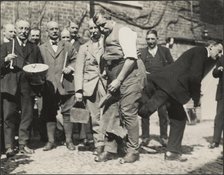 'Shoeing the Colts' ceremony during the Hocktide Festival in Hungerford, West Berkshire, 1925-1935. Creator: George R Long.