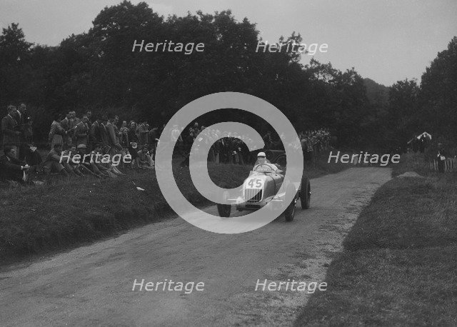Unidentified open single-seater car competing in the Shelsley Walsh Hillclimb, Worcestershire, 1935. Artist: Bill Brunell.