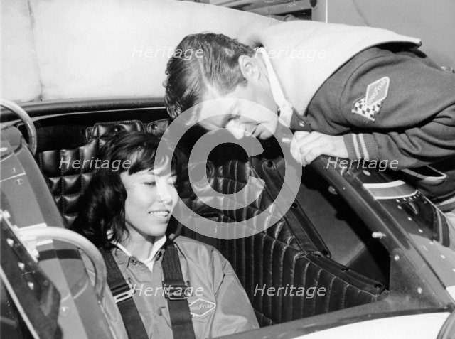 Craig Breedlove explaining the controls of 'Spirit of America Sonic I' to his wife, Lee, c1965. Artist: Unknown