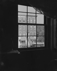 View from the bedroom window of Mrs. Ella Watson, a government worker, Washington, D.C., 1942. Creator: Gordon Parks.