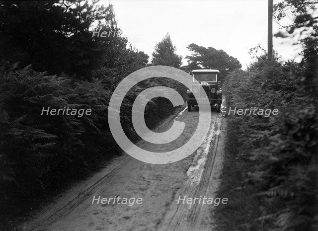 Morris Minor taking part in a First Aid Nursing Yeomanry trial or rally, 1931. Artist: Bill Brunell.