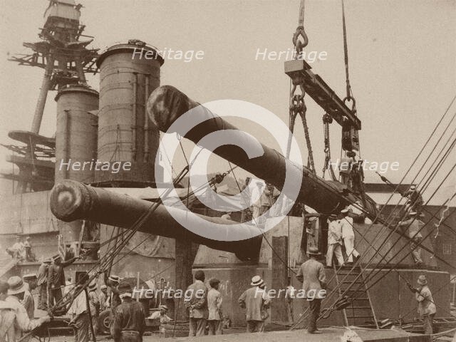 Installation of a gun in the Japanese battleship Hyuga at the Mitsubishi Nagasaki Shipyard, 1917-18. Creator: Anonymous.