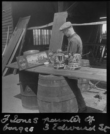 Barge painter Frank Jones, of 3 Edward Street, at work, Leighton Buzzard, Bedfordshire, 1910-60. Creator: George R Long.