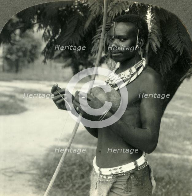 'The Finery of a Native Hunter in the Belgian Congo, Africa', c1930s. Creator: Unknown.