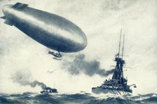 'Twixt Sea and Sky. British Airship Towed by Warship', 1917. Creator: Unknown.