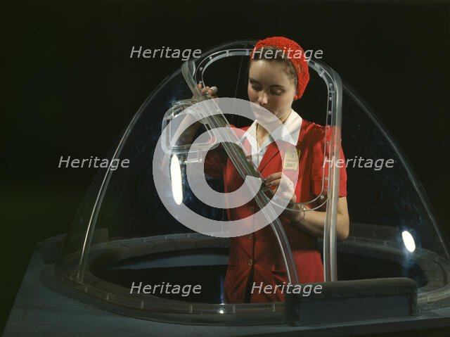 This girl in a glass house is putting finishing touches..., Long Beach, Calif. , 1942. Creator: Alfred T Palmer.