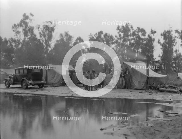 Migrant pea pickers camp in the rain, California, 1936. Creator: Dorothea Lange.