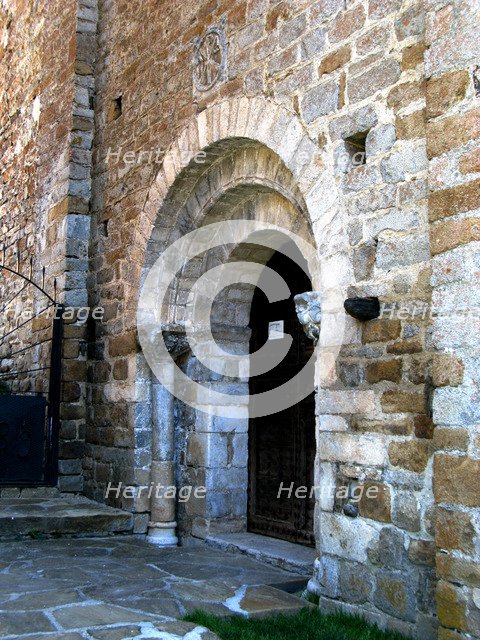West Portal of the church of Santa Maria in Cap d'Aran Tredós, the portal has three round arches …