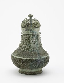 Lidded ritual wine container (hu) with masks and dragons, Late Shang dynasty, c13th century BCE. Creator: Unknown.
