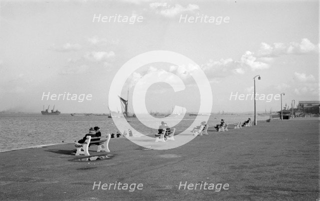 Couples sit on benches on the promenade at Gravesend, Kent, c1945-c1965. Artist: SW Rawlings