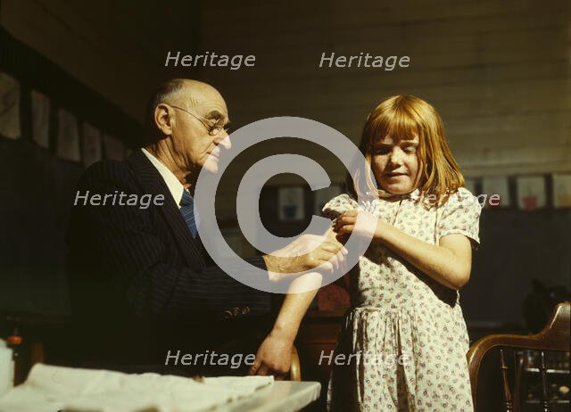 Dr. Schreiber of San Augustine giving a typhoid innoculation..., San Augustine County, Texas, 1943. Creator: John Vachon.
