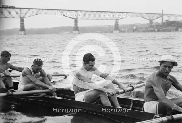 Stanford University crew rowing on Hudson River with Poughkeepsie Bridge..., between c1910-c1915. Creator: Bain News Service.