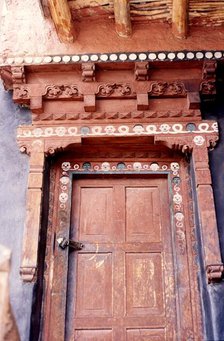 Door with skulls and faces, Ladakh, India, 1988. Creator: Amanda Waite.