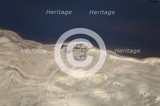 A ruined building revealed by low water levels at Ladybower Reservoir, Derbyshire, 2022. Creator: Emma Trevarthen.