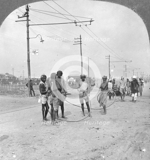 Men about to draw a heavy load, Rangoon, Burma, 1908. Artist: Stereo Travel Co