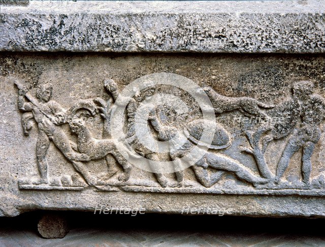 Etruscan stone sarcophagus with reliefs of Eastern influence, with scenes of hunting and battle.
