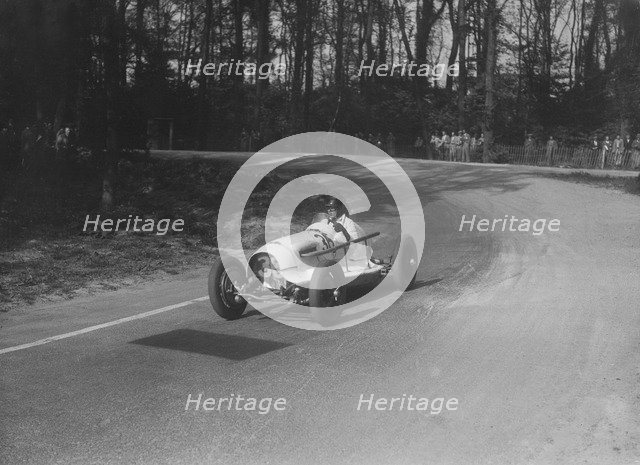 Riley offset-bodied single seater of Hector Dobbs racing at Donington Park, Leicestershire, 1935. Artist: Bill Brunell.