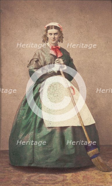 A man in drag holding a broom, 1862. Creator: Unknown.