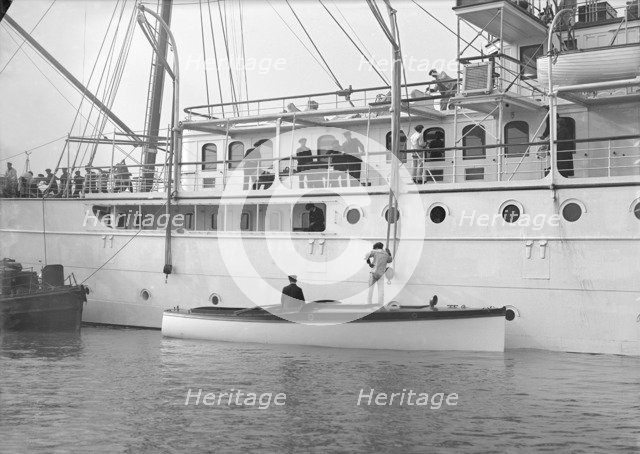 Liberty's motor launch alongside 'Liberty', 1914. Creator: Kirk & Sons of Cowes.