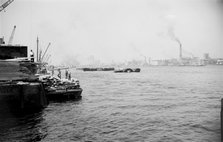 A view across the River Thames at Woolwich Reach, c1945-c1965. Artist: SW Rawlings