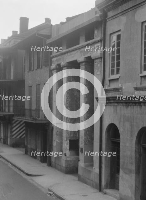 Buildings, including the Arsenal, along St. Peter Street, New Orleans, between 1920 and 1926. Creator: Arnold Genthe.