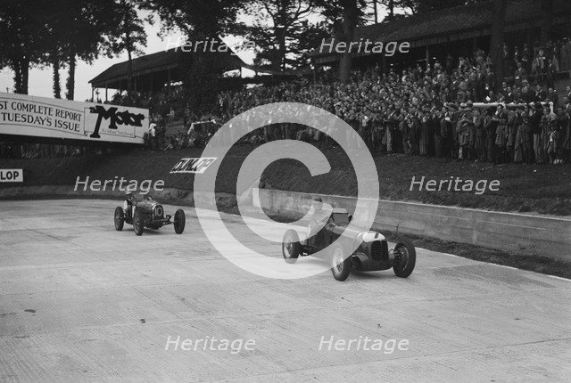 Maserati leading Charles Mortimer's Bugatti Type 35B at Brooklands, Surrey, 1939. Artist: Bill Brunell.