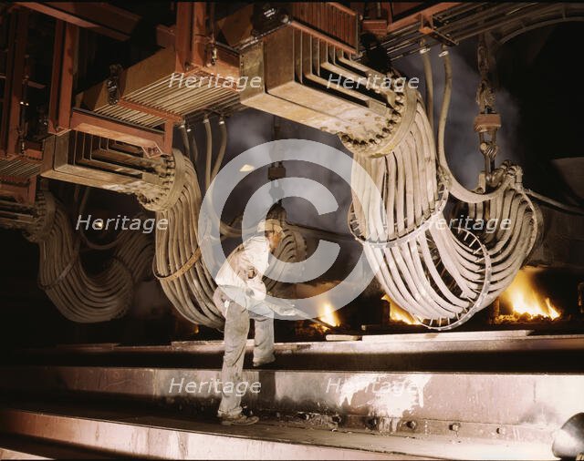 Large electric phosphate smelting furnace used in the making...Muscle Shoals area, Alabama, 1942. Creator: Alfred T Palmer.