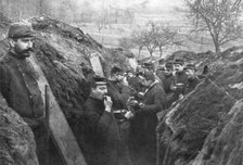French soldiers in the trenches eating their rations, France, 1915. Artist: Unknown